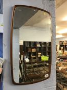 A teak frame mirror