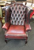 A Chesterfield oxblood high back armchair