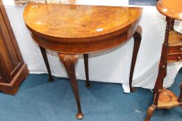 A walnut Queen Anne style half moon and crossbanded fold over card table, 77cm wide