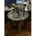 A Persian design coffee set, on folding stand