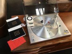 A Bang and Olufsen Beogram 1200 record deck, with spare cartridge.