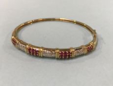 A 9ct gold bracelet, mounted with rubies and diamonds, 10g