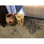 Two garden pots and a horseshoe stand