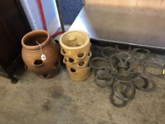 Two garden pots and a horseshoe stand