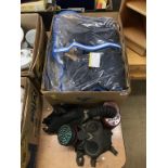 A box containing an RAF flight sergeant uniform and two gas masks