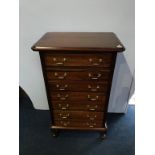 A narrow mahogany chest of drawers, with four long drawers, 68cm wide