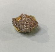 An unmarked (18ct gold?) diamond cluster ring.