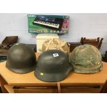 Four various military tin helmets