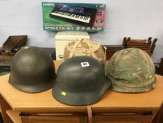 Four various military tin helmets