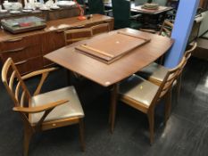 A teak extending McIntosh dining table and six chairs
