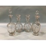 A pair of cut glass decanters and two others