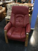 A Himolla red leather recliner armchair
