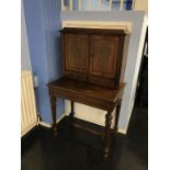 A 19th century rosewood and ornate brass inlaid ladies writing desk, the top with cupboard doors and