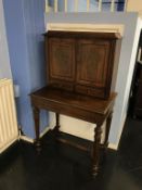 A 19th century rosewood and ornate brass inlaid ladies writing desk, the top with cupboard doors and