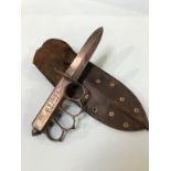 A US MK1 trench knife and leather scabbard, stamped US 1918 L. F. and C. 1918