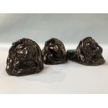 A set of three Victorian 'Lion' pottery sash window rests