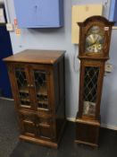 An oak Grandmother clock and an Old Charm cabinet
