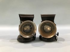 A pair of cycle oil lamps