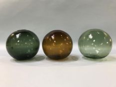 Three glass witches balls