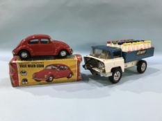 A Tri-ang milk truck and a tin plate Beetle