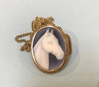 A 9ct gold mounted horse's head cameo and chain total weigh 20 grams