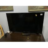 A Samsung TV, with remote