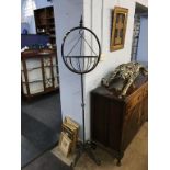 A metalwork hanging basket and stand