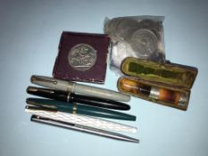 Various fountain pens and commemorative crowns etc.