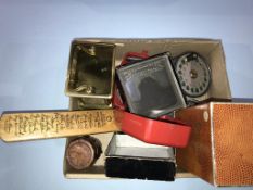 Box to include fly reels, a carriage clock, treen snuff box, local slides etc.