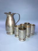 A silver coloured wine vessel and six tumblers (all stamped silver), weight 43oz