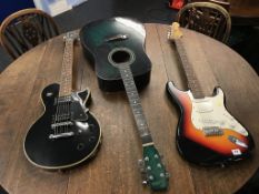 A Tanglewood Starfire TSE 501, an Encore acoustic guitar and an Encore electric guitar