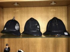 Three Police helmets