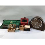 A carving set, mantle clock and medals etc.
