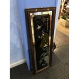 A decorative framed mirror