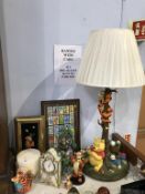 A collection of Winnie the Pooh memorabilia, including large Tigger and Pooh table lamp