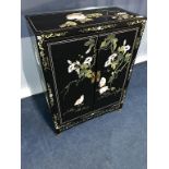 An Oriental lacquered two door cabinet, 59cm wide