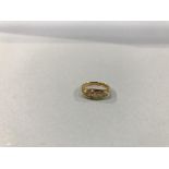 An 18ct gold, five stone diamond ring, 2.7g, size 'K/L'
