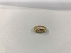An 18ct gold, five stone diamond ring, 2.7g, size 'K/L'