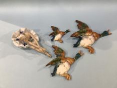 A Continental figure of a Ballerina and three Beswick wall mounted flying ducks