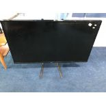 An LG TV (WITH REMOTE)