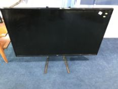An LG TV (WITH REMOTE)