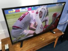A Toshiba TV (WITH REMOTE)