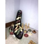 A collection of miniature shoes, handbags and hats etc., on a shoe stand