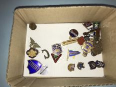 A collection of enamel badges