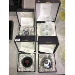 Four boxed Caithness paperweights 'Laticino', 'Silver Moonflower', 'Flower in the Rain' and '