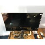 A Sony TV (WITH REMOTE. NO POWER LEAD)