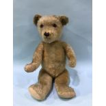 A plush jointed teddy bear, 58cm tall