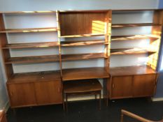 A teak three section wall unit and a walnut occasional table