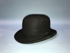 A Dunn and Co. bowler hat