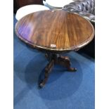 A reproduction mahogany tripod table